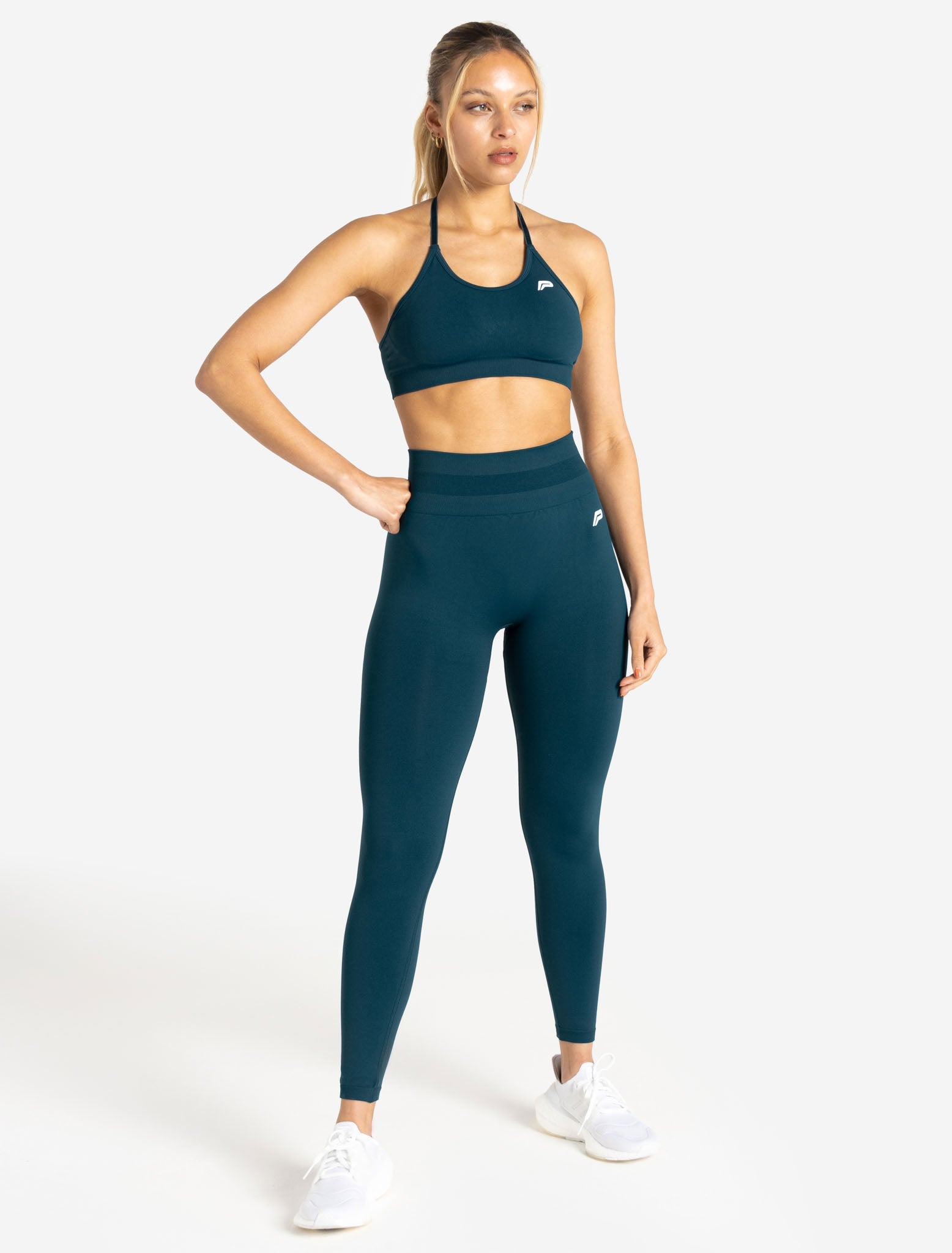 Woman in Teal Sports Bra and Brown Leggings · Free Stock Photo